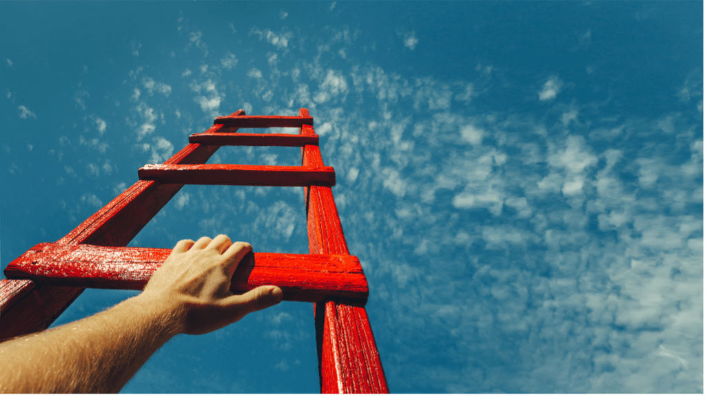 Man holding ladder to motivate a team
